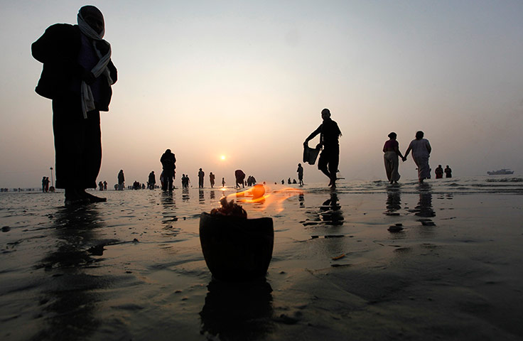 Ganges: Pilgrims gather on the banks of the river Ganges at Sagar Island