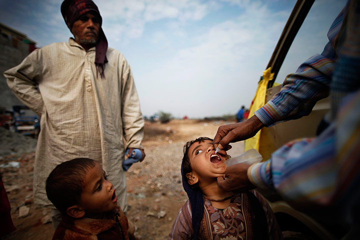 Polio vacination: A child is administered polio drops in New Delhi, India