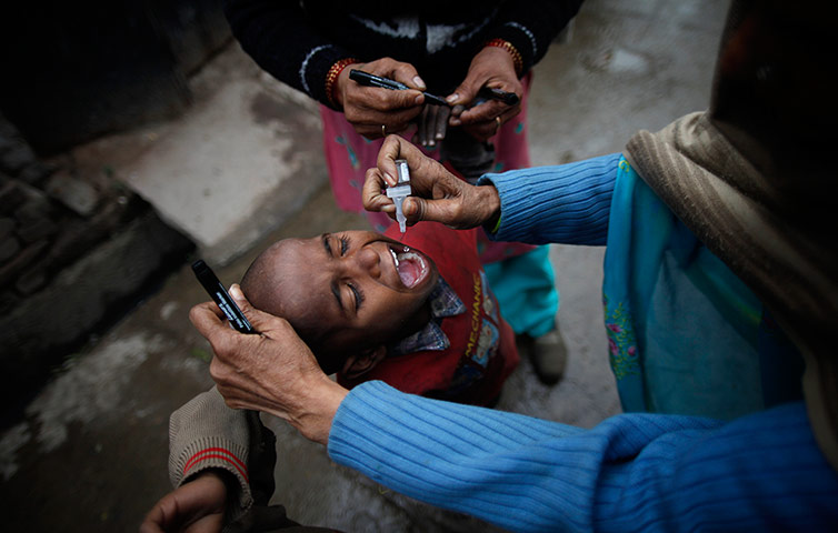 Polio vacination: A child accepts his polio drops