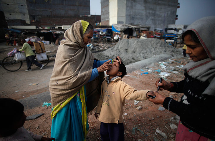 Polio vacination: A child is given polio drops 