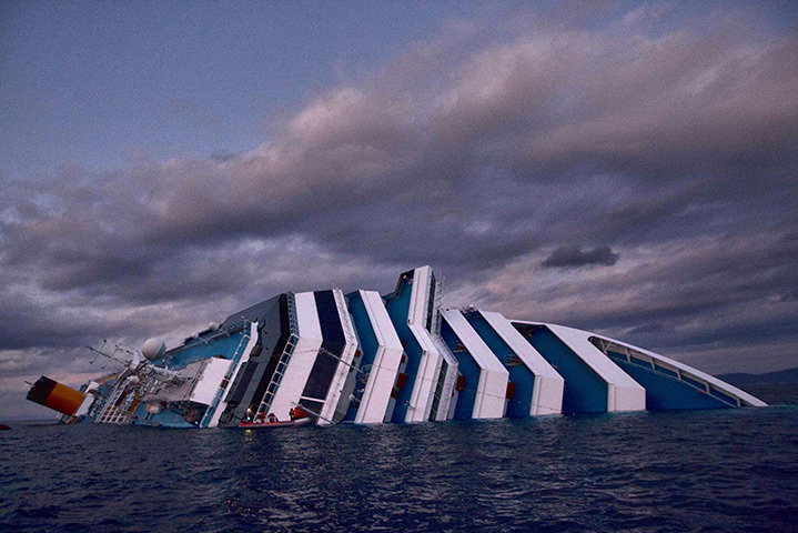 costa concordia: Only half of the vessel is seen above the waterline