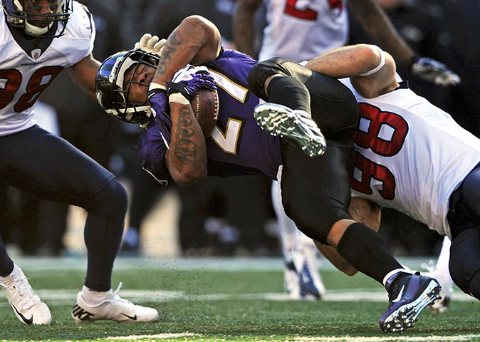 NFL Roundup: Ravens running back Rice is tackled by Texans linebacker Barwin