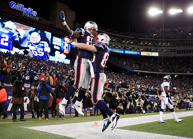 NFL Roundup: New England Patriots' Branch celebrates his touchdown with teammate Welker