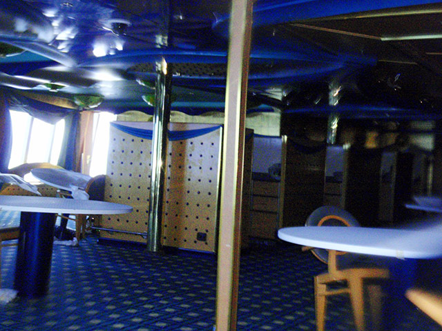 Costa Concordia: Tables and chairs float under water in one of the submerged decks