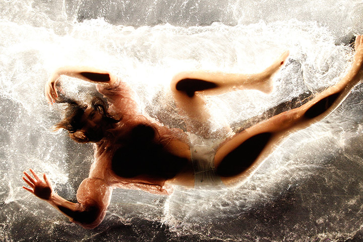 24 hours in pictures: Berlin, Germany: A dancer performs on a watery stage