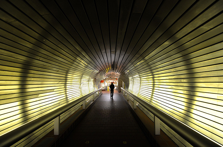 24 hours in pictures: New Haven, US: A man walks through a empty tunnel at Union Station