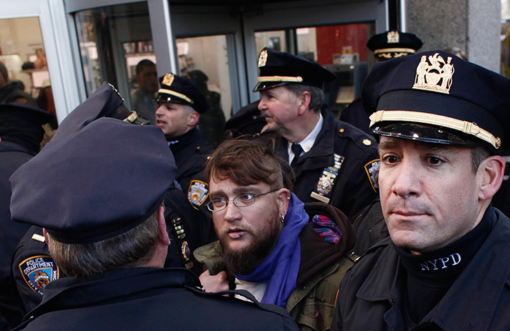 24 hours in pictures: New York, US: A man is arrested by NYPD officers