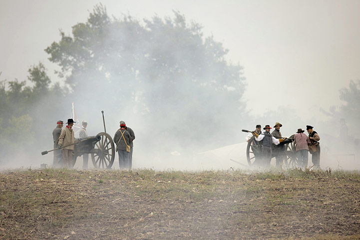 FTA: Michael Reynolds: Clouds of smoke surround Civil War reenactors as Confederate artillery