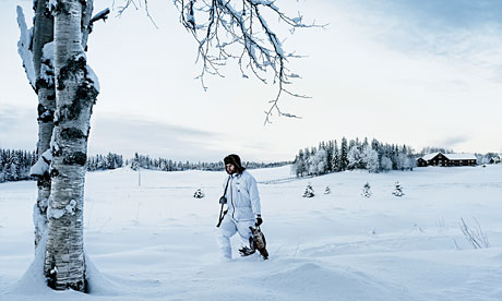 Magnus Nilsson, with gun and female black grouse