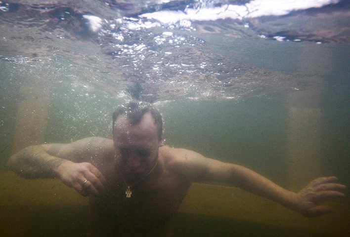 Orthodox Epiphany: A man takes a dip in the icy waters of the Istra river