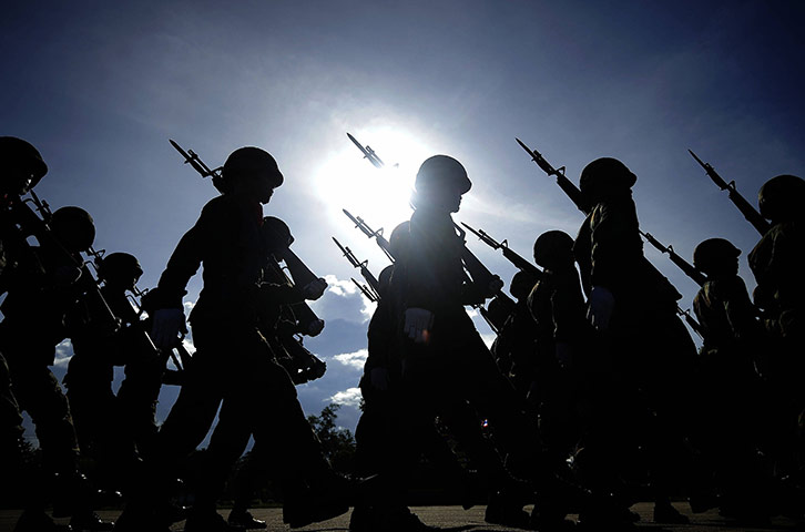 24 hours in pictures: Narathiwat, Thailand: Soldiers march in a parade