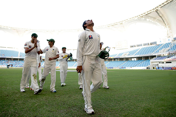 Pakistan v England day 3: Saeed Ajmal walks off the field after taking England's final wicket