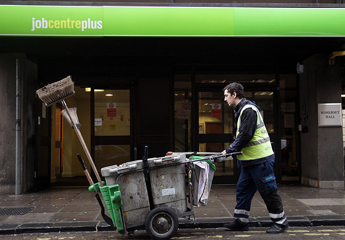 Week in Business: A street cleaner passes the Jobcentre Plus office in Bath