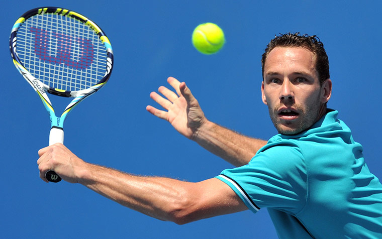Australian Open Day 4: Michael Llodra beats Alex Bogomolov Jr. 6-1, 6-3, 4-6, 5-7, 6-4