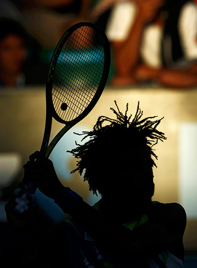 Australian Open Day 4: Gael Monfils follows through on a return to Thomaz Bellucci