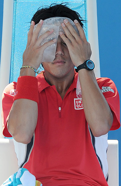 Australian Open Day 4: Kei Nishikori puts ice on his head during his victory over Matthew Ebden