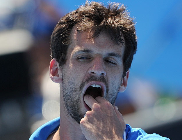 Australian Open Day 4: Philipp Petzschner gestures during his defeat to Milos Raonic