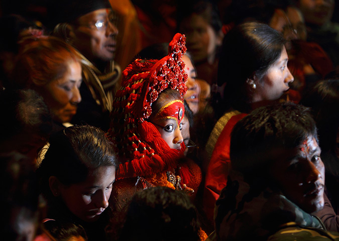 24 hours: Kathmandu, Nepal: Devotees gather around a Living Goddess Kumari 