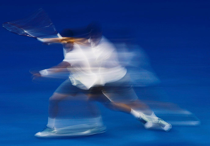 Aussie Open day 5: Bernard Tomic hits a return to Alexandr Dolgopolov 