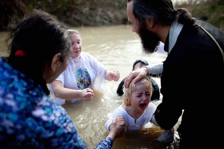 24 hours in pictures: orthodox christians celebrate epiphany at the river jordan