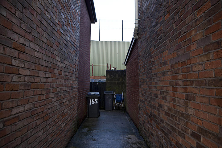 Peace Wall: The Peace Wall that runs towards Newtownabbey in Belfast