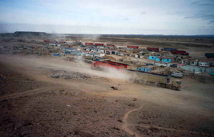China environmental year:  Trucks carrying coal begin the journey to the Chinese border