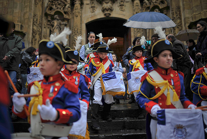 24 Hours: 'Tamborilleros' leave Saint Maria Church during the San Sebastian feast
