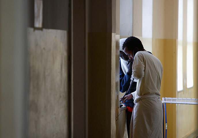 Somalia: Somali immigrants make a telephone call in Hal Far, Malta