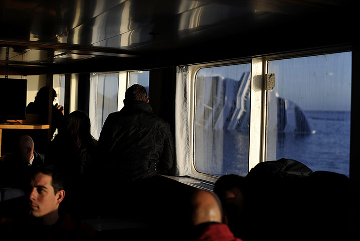 Concordia: People look at the stricken cruise liner Costa Concordia