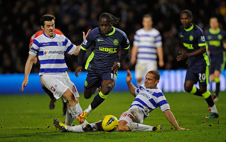 QPR v Wigan: QPR's Victor Moses is fouled by Wigan's Luke Young