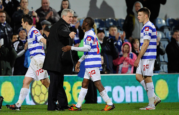 QPR v Wigan: Mark Hughes congratulates his players Barton, Wright-Phillips and Mackie 