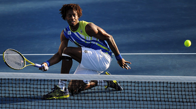 Aussie Open day 6: Gael Monfils lifts a volley over the net against Mikhail Kukushkin
