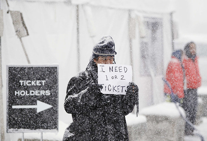 24 hours : Park City, Utah, USA: A man stands in a snowstorm at the Sundance Festival 