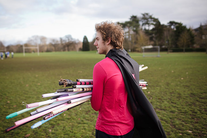 Muggle Quidditch: Worcester College's Mycchaka Kleinbort carries broomsticks to the pitch
