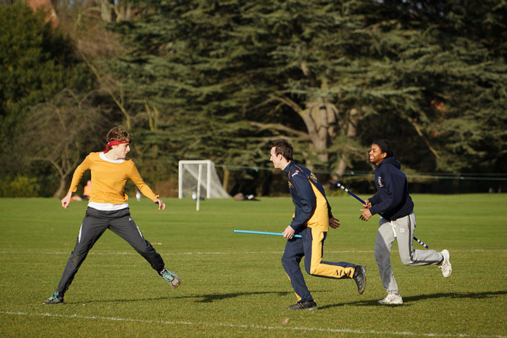 Muggle Quidditch: Steffan Danino, as golden snitch, fends off the two seekers