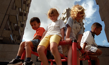 Young children playing at open air nursery on housing estate in London.