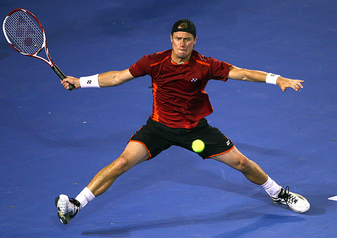 Australian Open Day 8: Lleyton Hewitt of Australia plays a shot against Novak Djokovic of Serbia