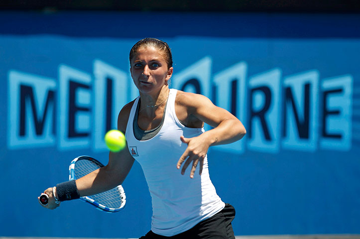 Australian Open Day 8: Sara Errani of Italy hits a return to Zheng Jie of China