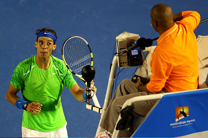 Aussie Open day 9: Rafael Nadal disputes a line call with the umpire 