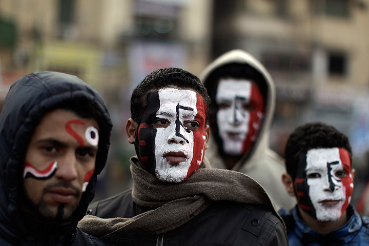 Egypt rally: Egyptians wear face paint in the colours of the national flag 