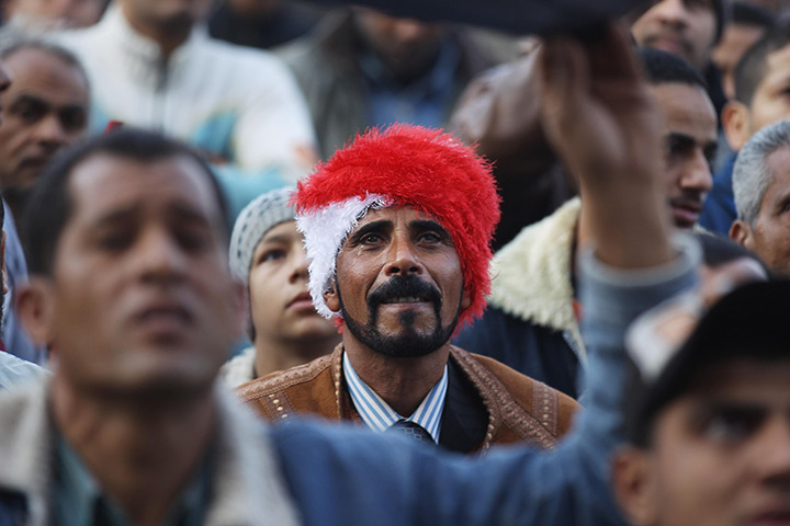 Egypt rally: An Egyptian man weeps during a rally in Tahrir Square