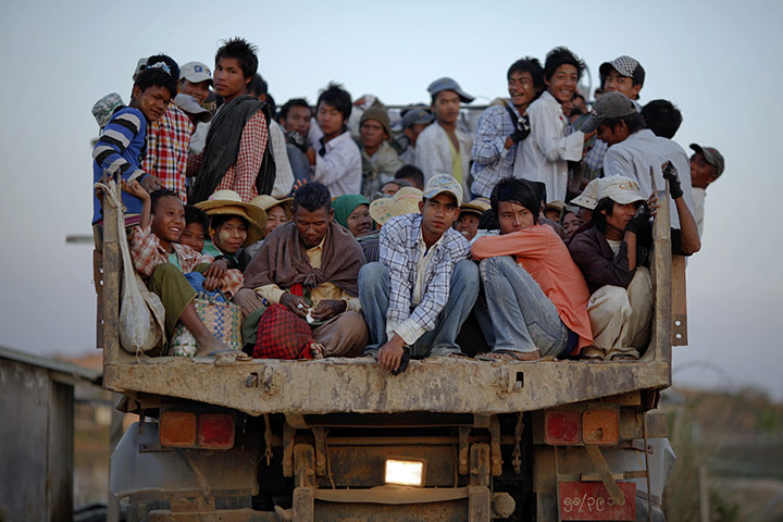 Burma economic reform: Workers are transported on a truck after finishing work in Naypyitaw