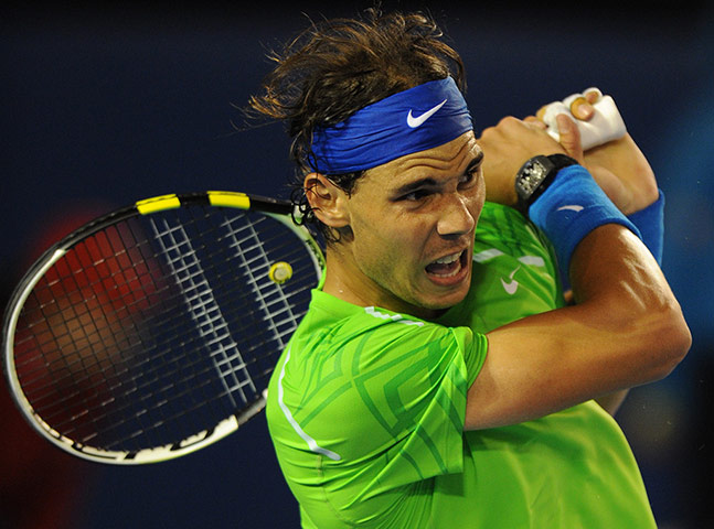 Aussie open day 11: Rafael Nadal plays a stroke during his semi-final against Roger Federer
