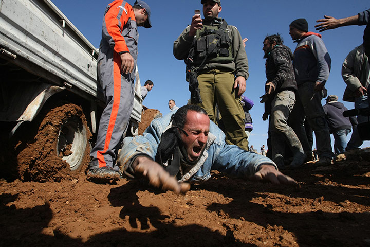 24 hours in pictures : An injured Palestinian construction worker in al-Dirat, West Bank
