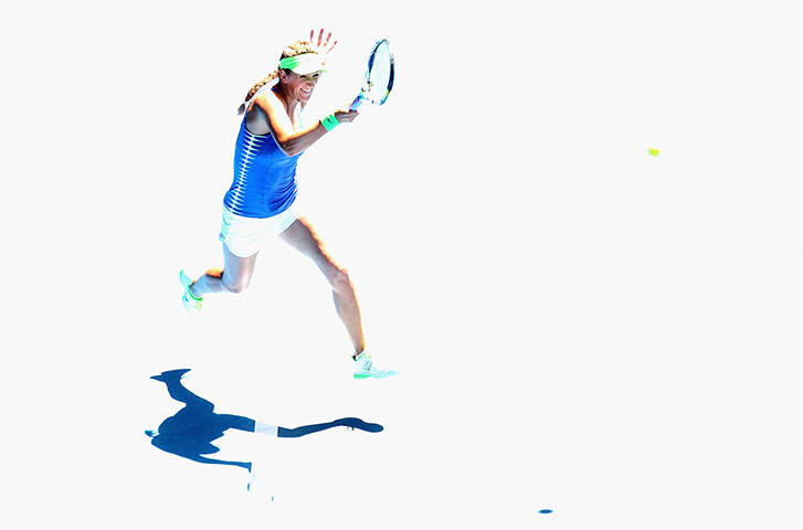 Aussie open day 11: Victoria Azarenka plays a shot to Kim Clijsters