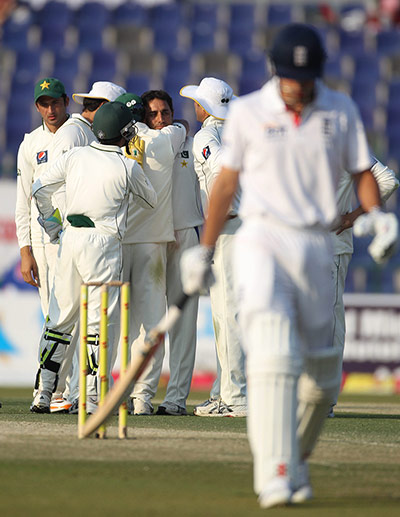 Pakistan v England day 2: Pakistan's Saeed Ajmal celebrates taking the wicket of Alastair Cook