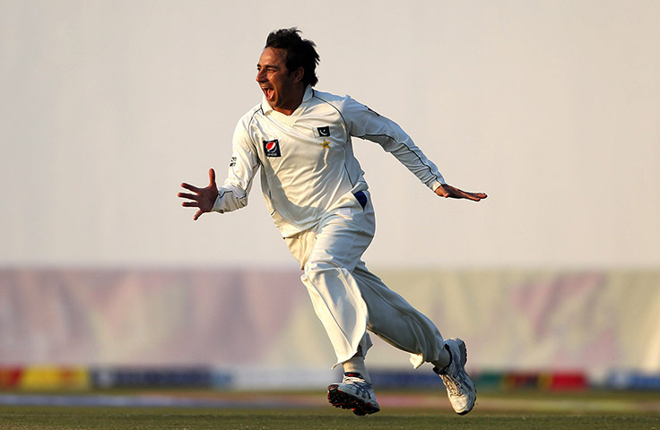 Pakistan v England day 2: Pakistan's Saeed Ajmal celebrates taking the wicket of Eoin Morgan