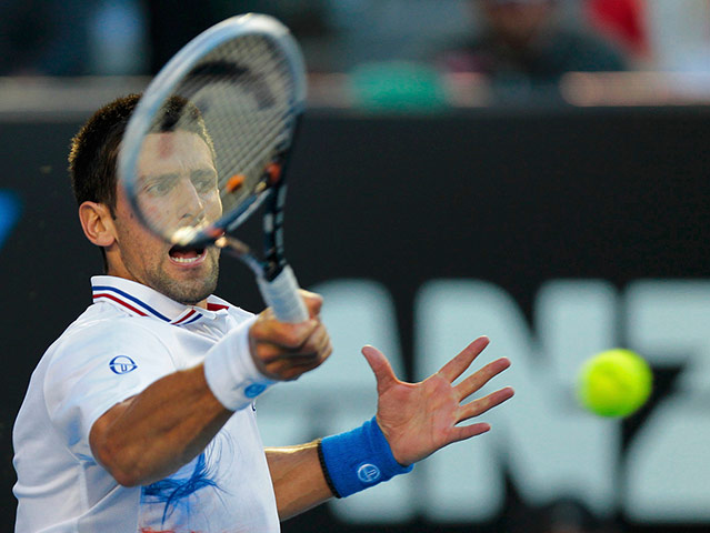 Murray v Djokovic: Djokovic hits a return to Murray 