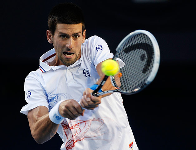 Murray v Djokovic: Novak Djokovic hits a return to Andy Murray 