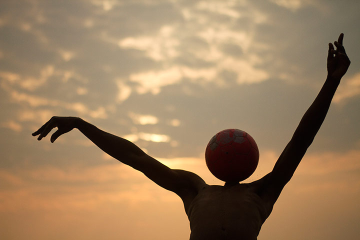Best of the week: A youth plays with a ball on the beach in Equatorial Guinea